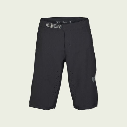 dark mtb shorts on green background
